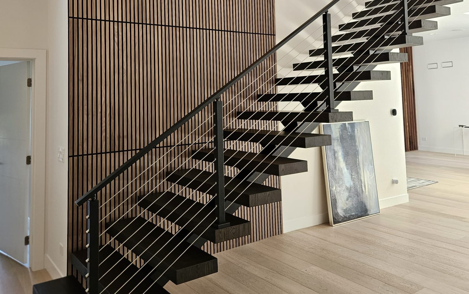 Custom walnut slat. Real floating stairs